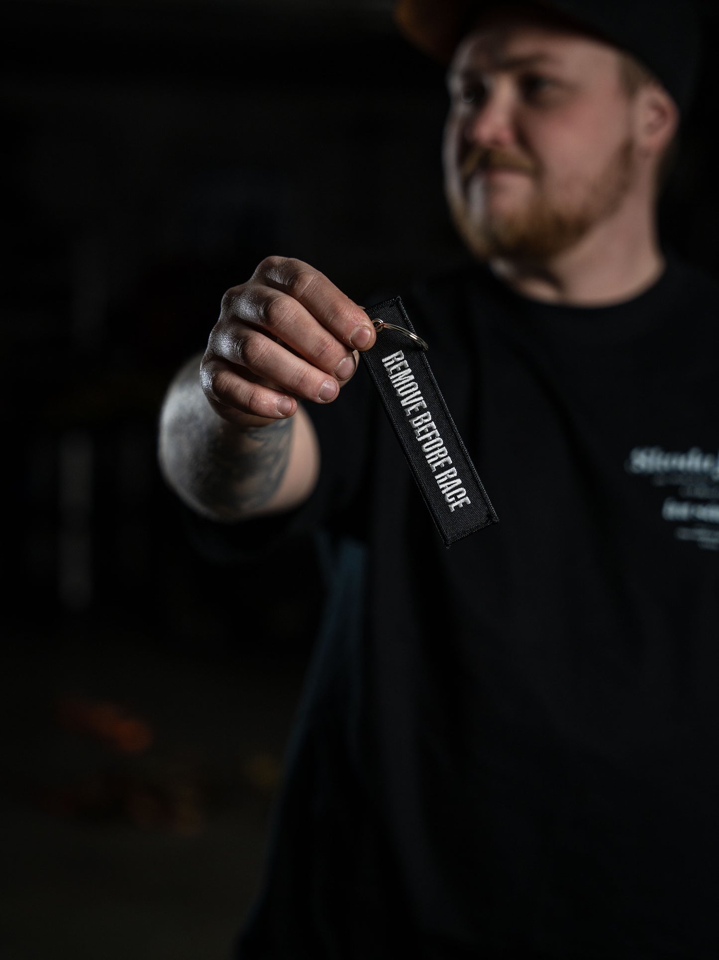 Ida Zetterström Keychain - Remove before Race - Black